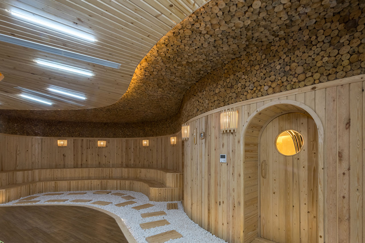 Wooden sauna with premium, modern interiors, warm lighting.